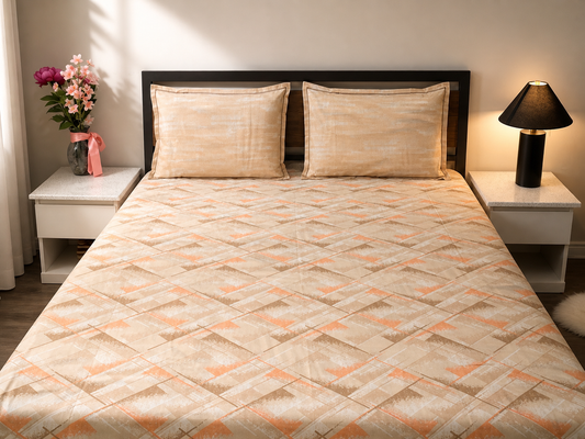 Bedroom with a bed featuring a diamond patterned quilt, two nightstands with lamps, and a vase of flowers.